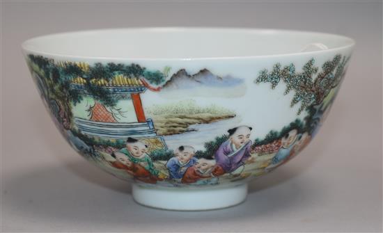 A Chinese porcelain bowl, painted with infants in a landscape, diam. 13.5cm